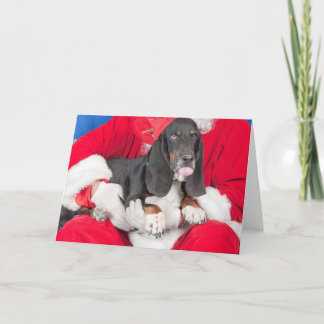 Basset som klibbar tungan ut på Santas varv Helgkort