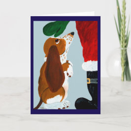 Basset-valp får en husdjur från Tomte Inbjudan