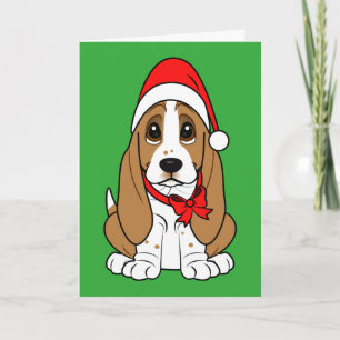 Bassethund i den Santa hatten på jul Helgkort