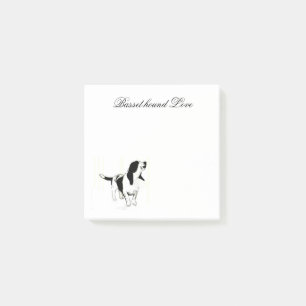 Bassethund som posta-det noterar post-it block