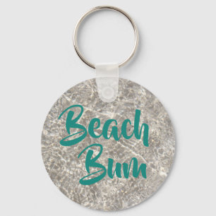 Beach bum vatten på strandsand nyckelring