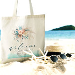 Beach Destination Wedding Tote Bag Tygkasse<br><div class="desc">Gör en snyggt påstående med den här Beach Destination Wedding Tote Bag, perfekt för firande vid kusten. Den har en vattenfärgsdesign i blått, tealt, turkos och persikofärgat, tillsammans med delikat blommigt, och erbjuder en chic och boho vibe. Med "Välkommen" i ord i elegant-skript är den här väskan en idealisk keepy...</div>