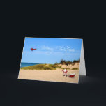 Beach Santa Greeting Card Helgkort<br><div class="desc">En liten jul hälsning med tomten och hans sled på stranden med skyskrivande flygplan som flyger ett God jul-meddelande.</div>