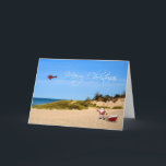 Beach Santa Greeting Card Helgkort<br><div class="desc">En liten jul hälsning med tomten och hans sled på stranden med skyskrivande flygplan som flyger ett God jul-meddelande.</div>