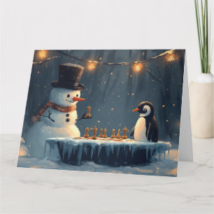 Bedårande snöman och pingvin som spelar schack kort