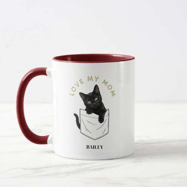 Bedårande svart katt i ficknamn mugg (Vänster)