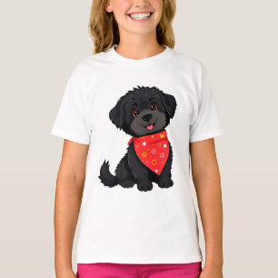 Bedårande svart valp som bär en röd bandana t shirt