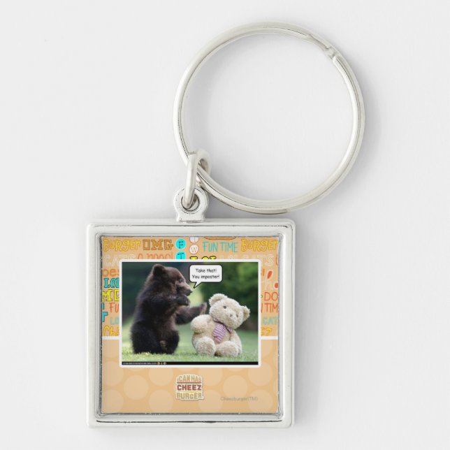 Bedragare! Fyrkantig Silverfärgad Nyckelring (Framsidan)