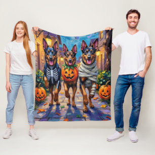 Belgiska vallhundar som söker godis under Hallowee Fleecefilt