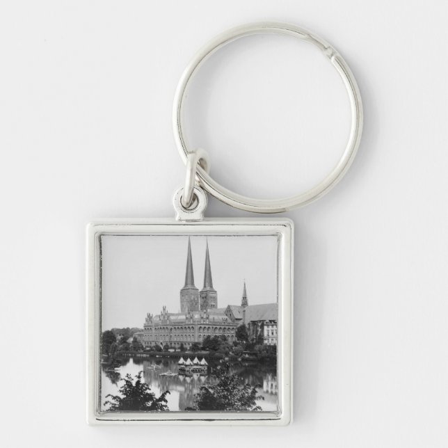 Beskåda av museet fyrkantig silverfärgad nyckelring (Framsidan)