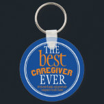 Best Caregiver någonsin Typography Blue Nyckelring<br><div class="desc">Perfekt som ett tack för att du uppskattar presenten för din vårdgivare/vårdassistent/vårdpersonal.Kompis av blå bakgrund med typografiktext i vitt och orange och vitt gräns. Texten lyder: Tack för att ni är en fantastisk-medhjälpare". Du kan byta ut karenseraren till namn till kostym till din stödjande vårdare eller kasearbetare. Det skulle också...</div>