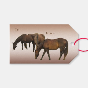Betande hästpacke av gåvamärkre presentetikett