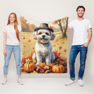 Bichon Frise i höstlöv tackgivandekonst Fleecefilt