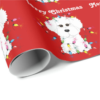 Bichon Frise tänder jul som slår in papper Presentpapper