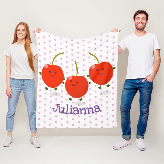 Bild på tecknaden Cute-hoppande röda körsbär Fleecefilt (På plats)