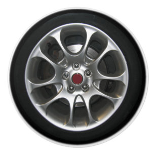 Bilen rullar och den grafiska hubcapen 2D Knopp