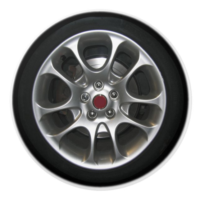 Bilen rullar och den grafiska hubcapen 2D Knopp (Framsidan)