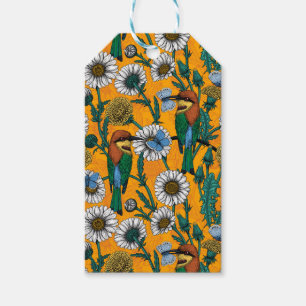 Bin, blå fjärilar och daisy på orange presentetikett