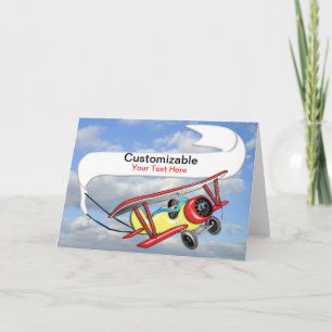 Biplane som bogserar baneranpassade kort