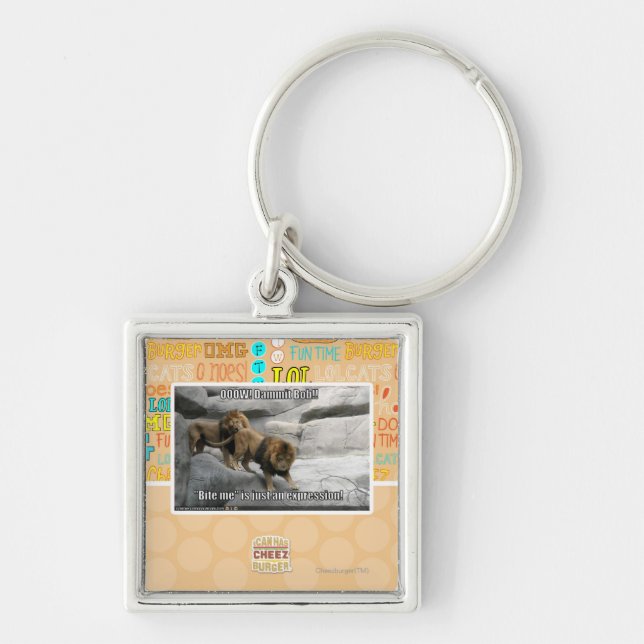 Bita mig är precis ett uttryck! fyrkantig silverfärgad nyckelring (Framsidan)