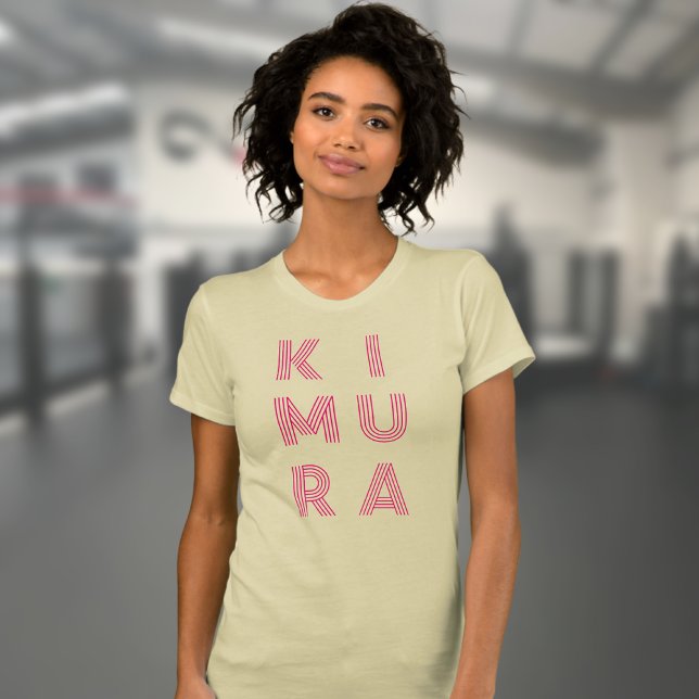 BJJ Kimura Womans Jiu Jitsu Cream T Shirt (Kimura BJJ t-shirt in cream worn by a female model in the gym.)