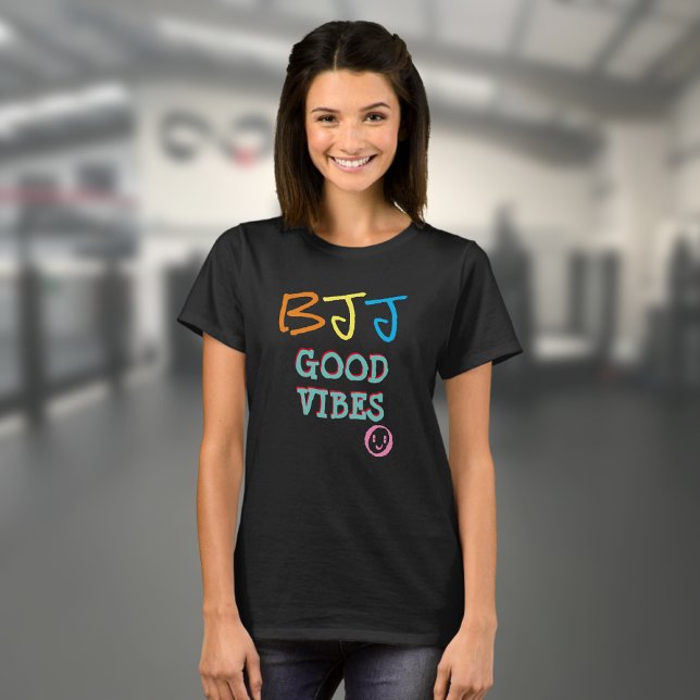 BJJ Retro Graffiti stil Good Vibes Black T Shirt (Black BJJ Good Vibes T shirt worn by a female model in a gym)