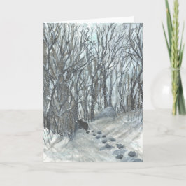 Björn i en snöig skog kort