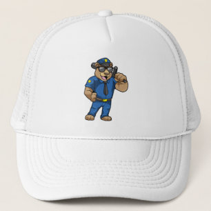 Björn som polis med polisiär uniform keps