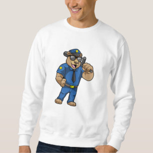 Björn som polis med polisiär uniform lång ärmad tröja