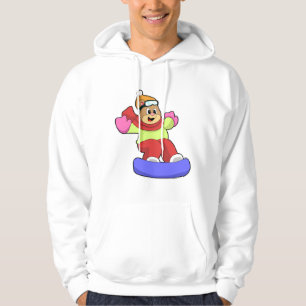 Björn vid snowboardingbombord med snötbord hoodie