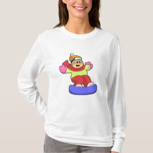 Björn vid snowboardingbombord med snötbord t shirt