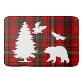 Björnhäst vid gräs träd vid rödsvarta tartan badrumsmatta