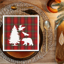 Björnhäst vid gräs träd vid rödsvarta tartan pappersservett