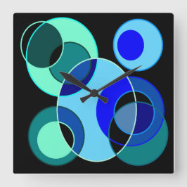 Blå cirklar och grönt som korsar varandra fyrkantig klocka