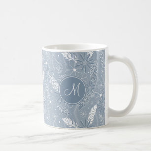 Blå fjädrar från dammsuga fjädrar från blommor i m kaffemugg