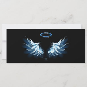 Blå glowing Angel Vingar på svart bakgrund Julkort