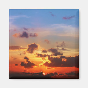 Blå himmel och röd solnedgång magnet