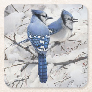 Blå jays i en Snö-fylld Träd Underlägg Papper Kvadrat