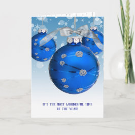 Blå julprydnad och snöflingor helgkort