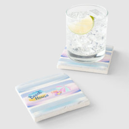 Blå och rosa strandhus i sten coaster stenunderlägg