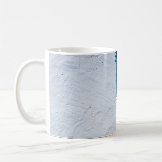 Blå och svart blommigt på vit sand kaffemugg (Vänster)