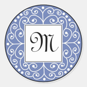 Blå och svart monogramsymbol runt klistermärke