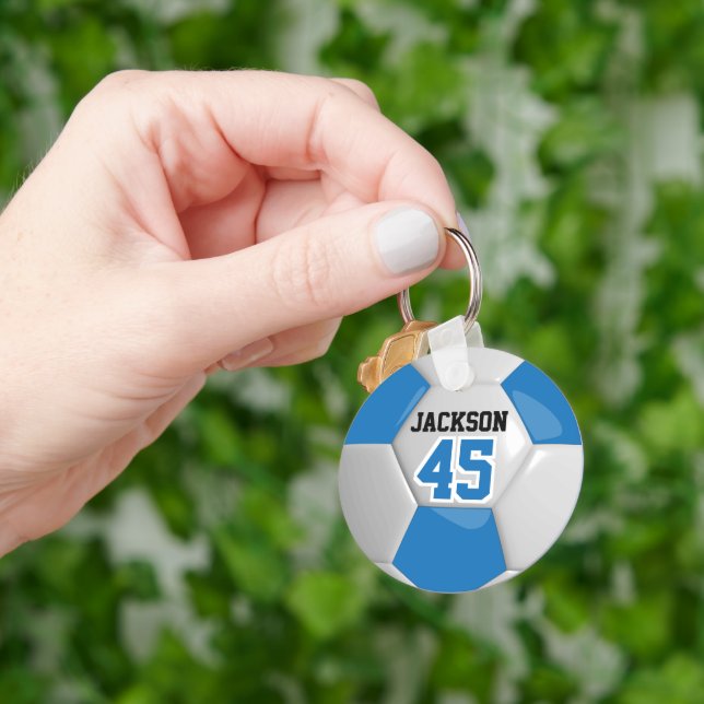 Blå och vit gruppfotboll ⚽ Boll Nyckelring (Hand)