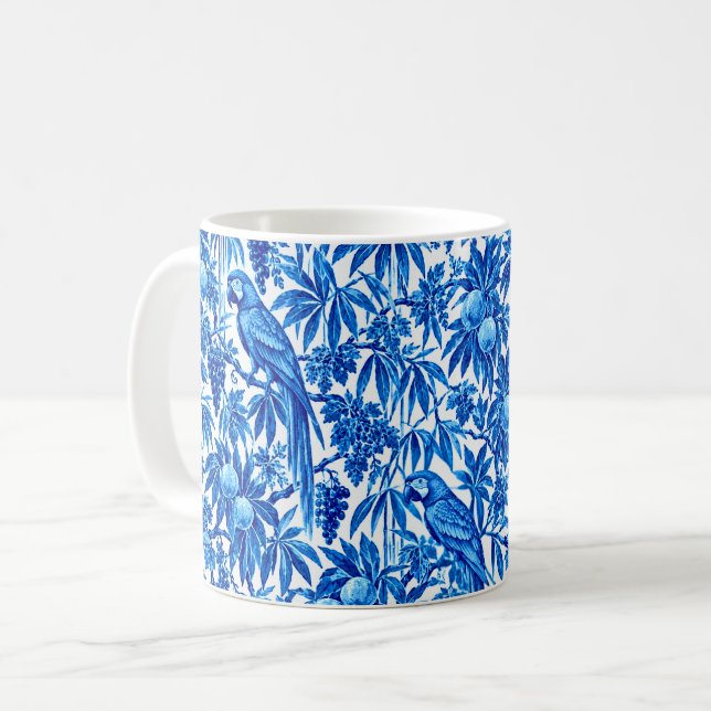 Blå papegojor i en tropisk trädgård kaffemugg (Framsida vänster)
