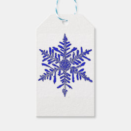 Blå presentförsedel i snöflingaform presentetikett