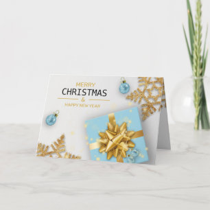 Blå presentlåda julgranskulor guld snöflingor kort