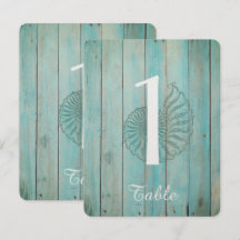 Blå snäckskal på trästrand bröllopsbord nummer