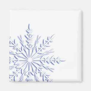 Blå snöflingor på vitt magnet