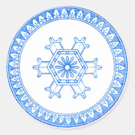 Blå snöflingor runt klistermärke