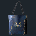 Blåblått och Guld marble Agate Tygkasse<br><div class="desc">Den här väskan har en elegant och en glamorös marmorbakgrund med geode gemstone och faux guld glitter accents. Monogrammet kombinerar handskript och modernt sans serif typsnitt för ett klassigt och sofistikerat utseende. Detta kommer att bli den idealiska presenten eftersom den kan anpassas med namn och en början. De djupblåa nyheterna...</div>